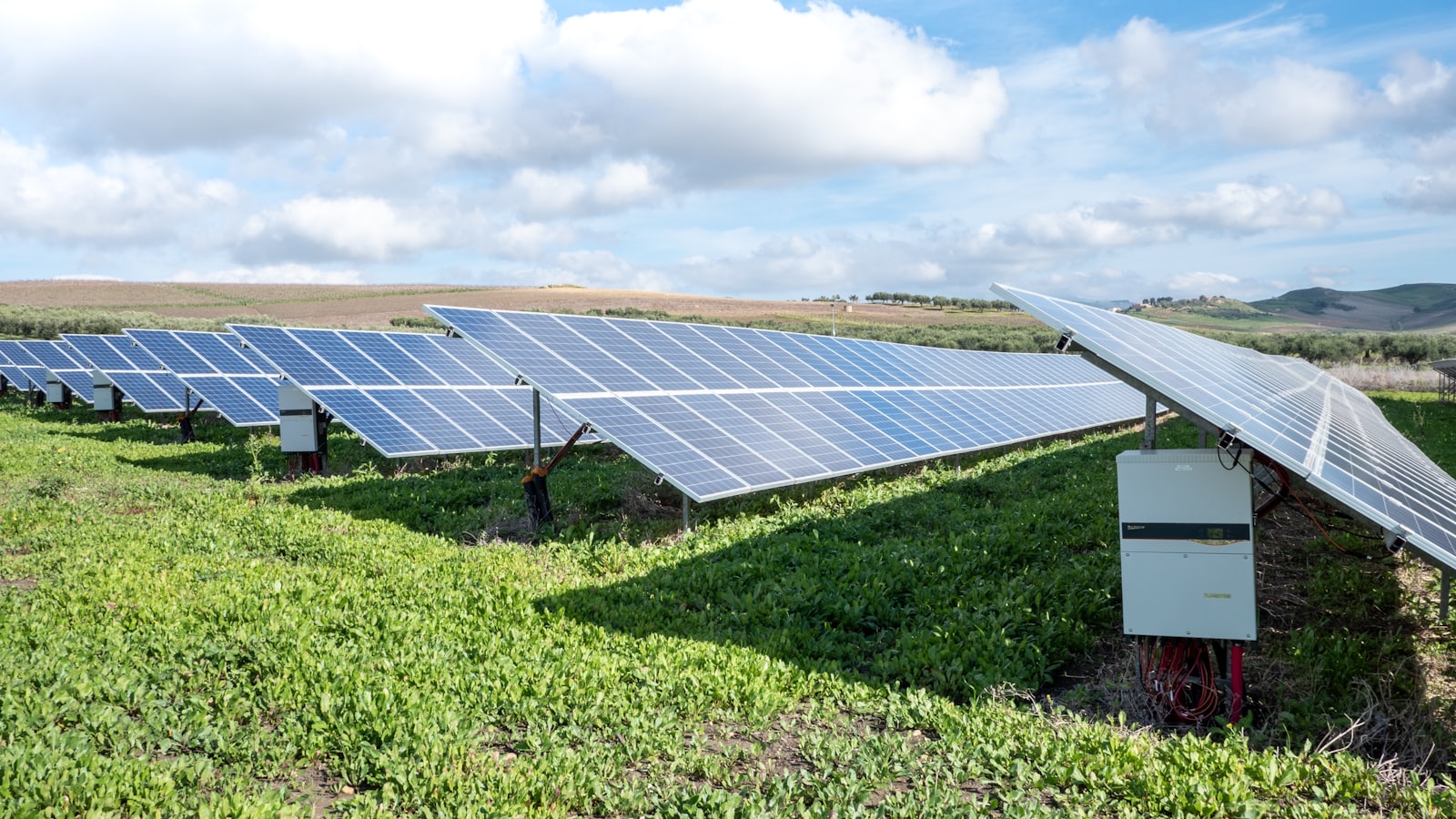 Solar panels in a green field